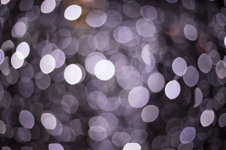 A mesmerizing bokeh effect with circular light patterns creating a sparkling abstract texture.